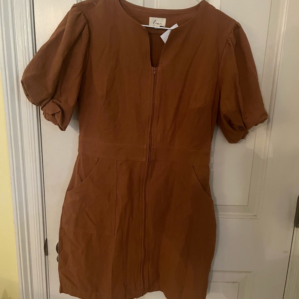 Lena dress. Size medium. New with tags. Cute tan dress with pockets